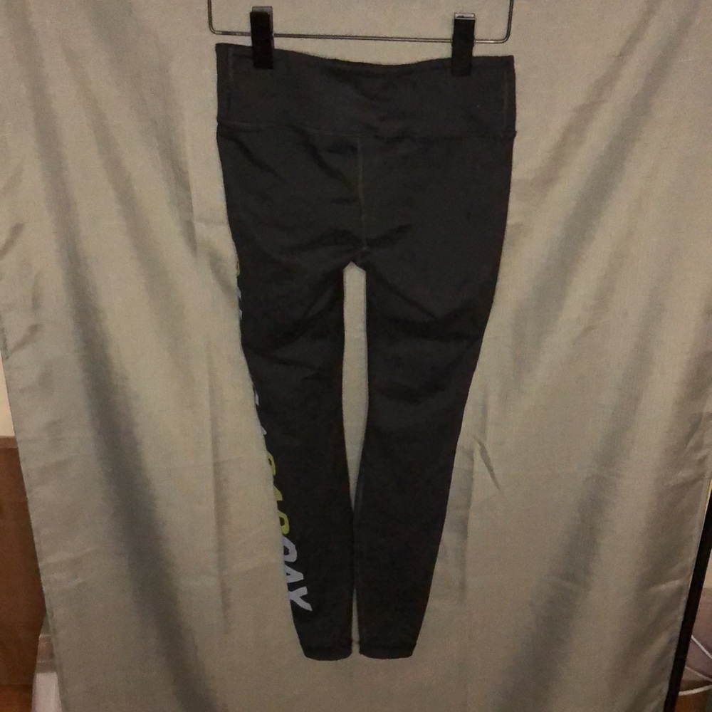 Aviator Nation Black Leggings with Yellow Smiley and White/Yellow Side Script - Picture 7 of 8